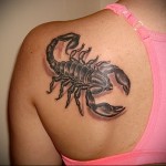 Scorpion tattoo on shoulder blade
