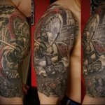 warrior tattoo on shoulder