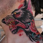оскал черного волка - татуировка на шее мужчины - фото