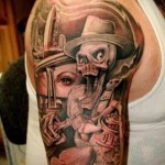 тату со страшеным черепом в шляпе - мужская татуировка на плече