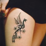 татуировка абстракция в форме птички на ногу для девушки
