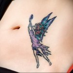 татуировка на женском животе с феей