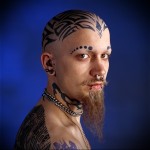 Man with Face Tattoos and piercings
