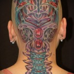 цветная женская тату на голове в стиле биомеханика