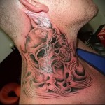 череп и 666 - татуировка на шее мужчины - фото