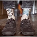 якорь и корабельный трос татуировка на ноге мужская