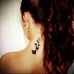 Butterfly tattoo on neck