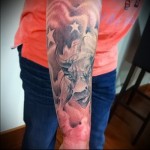 bull tattoo on his arm