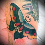 butterfly tattoo on her leg 1