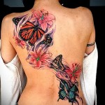 butterfly tattoo on the back of the photo