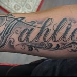 lettering tattoo on forearm