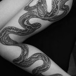 snake tattoo on his leg