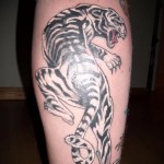 tiger tattoo on his leg 1