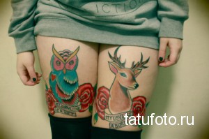 Фото двух татуировок на бедрах: сова с сердцем и олень с розами. Рисунки выполнены в ярком олдскульном стиле.