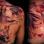 abstract tattoo on his back - a photo example of the number 21122015 1