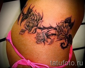 flower tattoo on the lower back - Picture option from the number 21122015 1