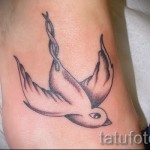 swallow tattoo on her wrist - Photo example 2
