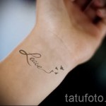 swallow tattoo on her wrist - Photo example 3