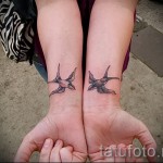 swallow tattoo on her wrist - Photo example 6