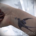 swallow tattoo on her wrist - Photo example 8