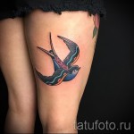 swallow tattoo on his back - a photo example 1