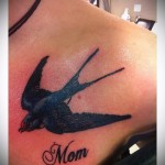 swallow tattoo on his chest - an example of the photo 5