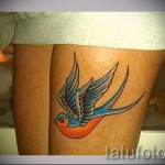 swallow tattoo on his leg - an example of the photo 4