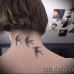 swallow tattoo on his neck - Photo example 1