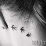swallow tattoo on his neck - Photo example 4
