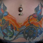 swallow tattoo on his stomach - an example of the photo 3