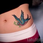 swallow tattoo on his stomach - an example of the photo 4
