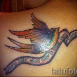 swallow tattoo on the blade - Photo example 1