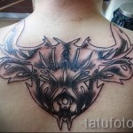 Фото готовой тату знак зодиака телец - необычный вариант на спину для парня - страшная татуировка