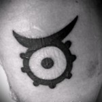 Фото готовой тату знак зодиака телец - символ с точкой в центре