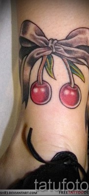 Cherry tattoo on his leg 1