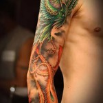 феникс в татуировке рукавом на руку - фото