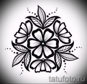 Черно-белый эскиз татуировки в виде цветочного круга с точками и листьями. Подходит для нанесения на руку или ногу.