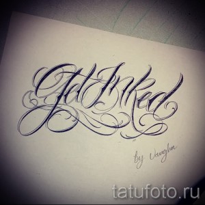 Эскиз тату: Надпись 'Get Inked' в каллиграфическом стиле, подписанный мастером Vaughn. Черно-белый рисунок для татуировки.