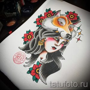 Фото эскиза татуировки, изображающего девушку с головой лисы, украшенной цветами. Изображение выполнено в стиле олд скул с использованием ярких цветов и четких контуров.