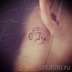 Mickey Mouse tattoo behind the ear 2