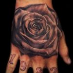 Rose tattoo on his hand Man 1