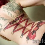 bow tattoo on her back - Photo example of the finished tattoo 02052016 1