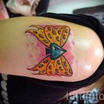 bow tattoo on his arm - Photo example of the finished tattoo 02052016 1