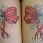 bows tattoo on his feet behind the photo - Photo example of the finished tattoo 02052016 1