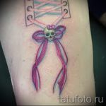 bows tattoo on his feet behind the photo - Photo example of the finished tattoo 02052016 3