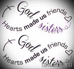 Фото тату с надписью 'God made us friends, Hearts made us sisters' и изображением креста и сердца, выполненное в черном цвете.