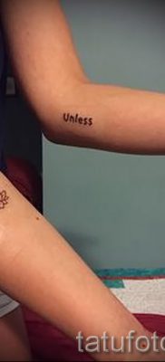 value lotus tattoo on the arm of the girl 2
