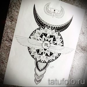 Фото эскиза татуировки, сочетающего в себе знак зодиака Скорпион, луну с крыльями и сложную мандалу, выполненную в технике дотворк.