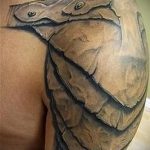 тату на плече мужские кожаные доспехи фото - пример готовой татуировки от 16052016 4