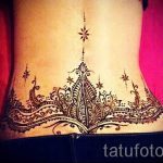 lace tattoo on the lower back 1